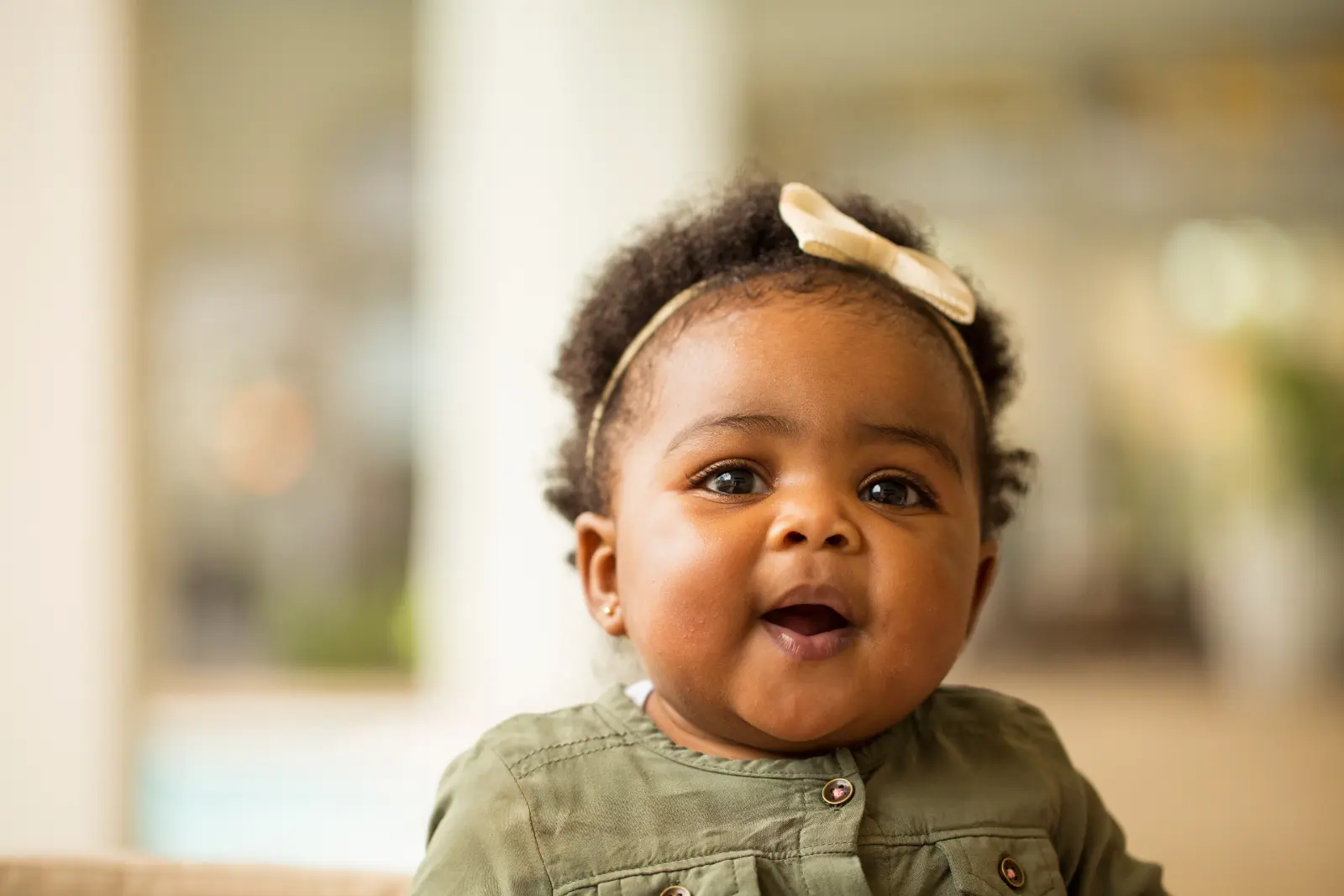 Adoption Contact Agreements Affect Emotions: Adorable portrait of a baby adorned with a cute headband, capturing the emotional essence of adoption.