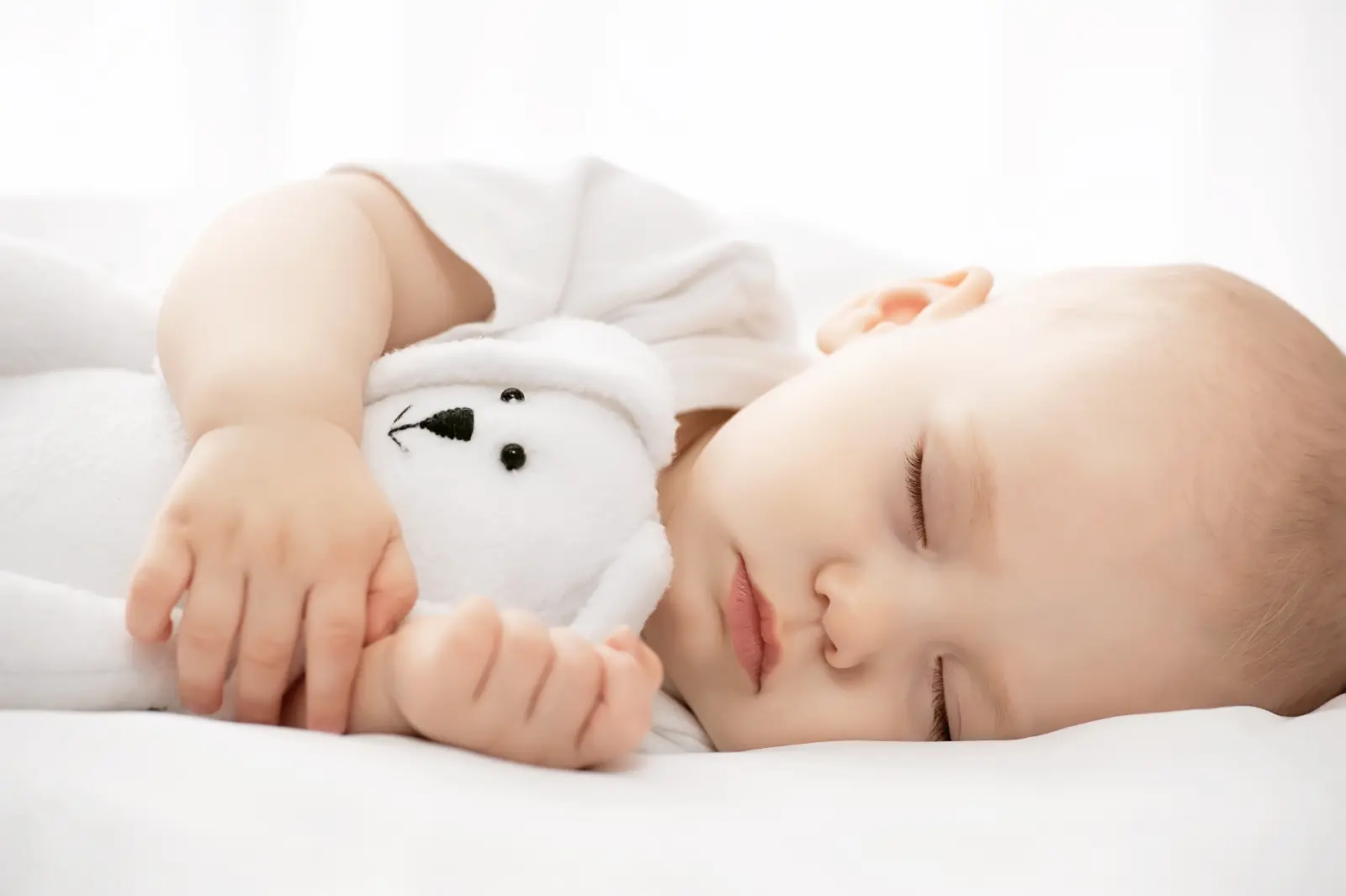 Contact Agreements Advantageous a sleeping baby holding plushie.