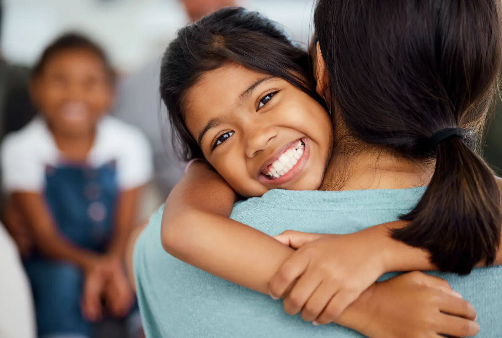 Girl, mother and bonding hug in house or home living room intrust. Optimizing Post-Adoption Visitation