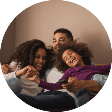 Color image in a circular frame of a happy family of three.