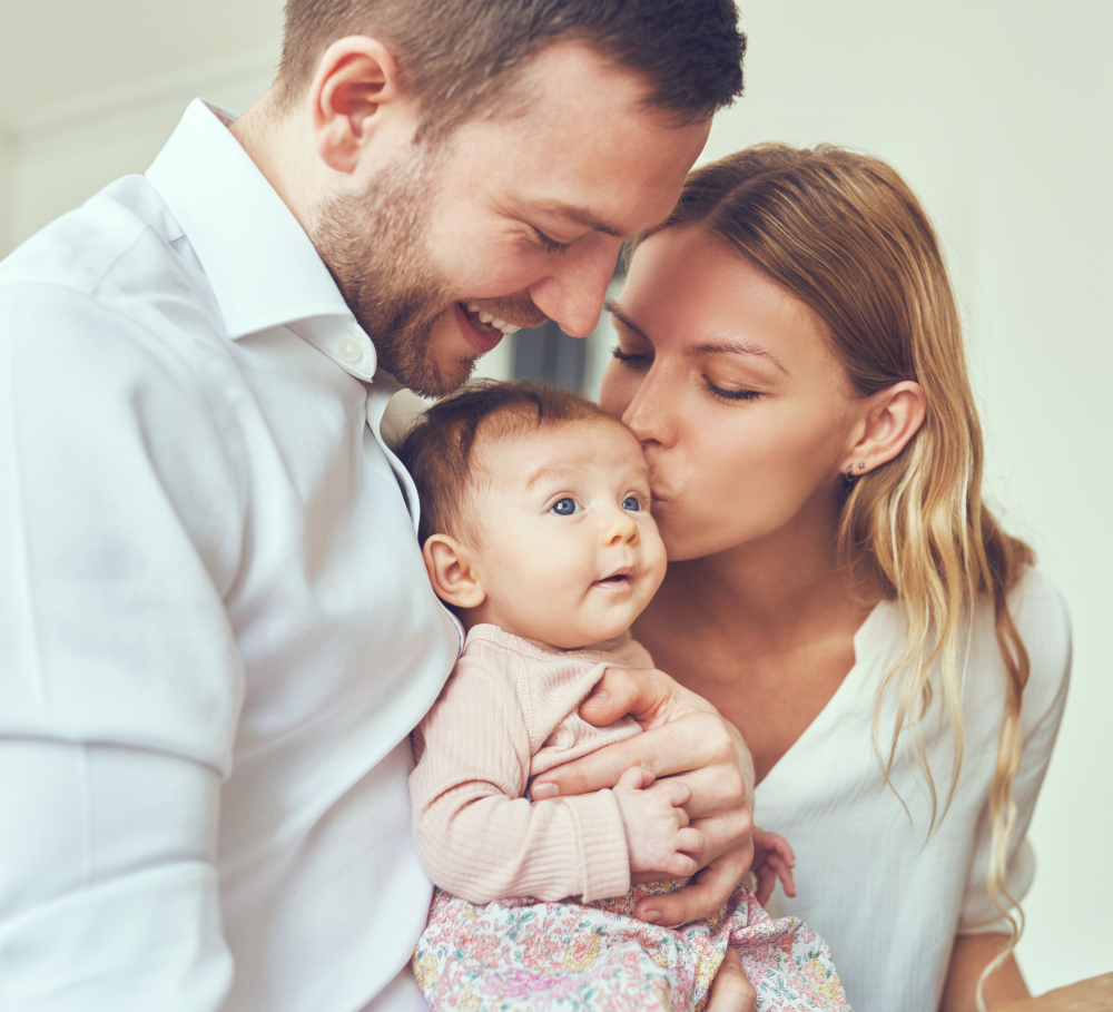 acfad9ee6803cce5450798a123fe0b86d9c147e9 (1) Color image in a circular frame of an infant's hand being held by an adult's hands
