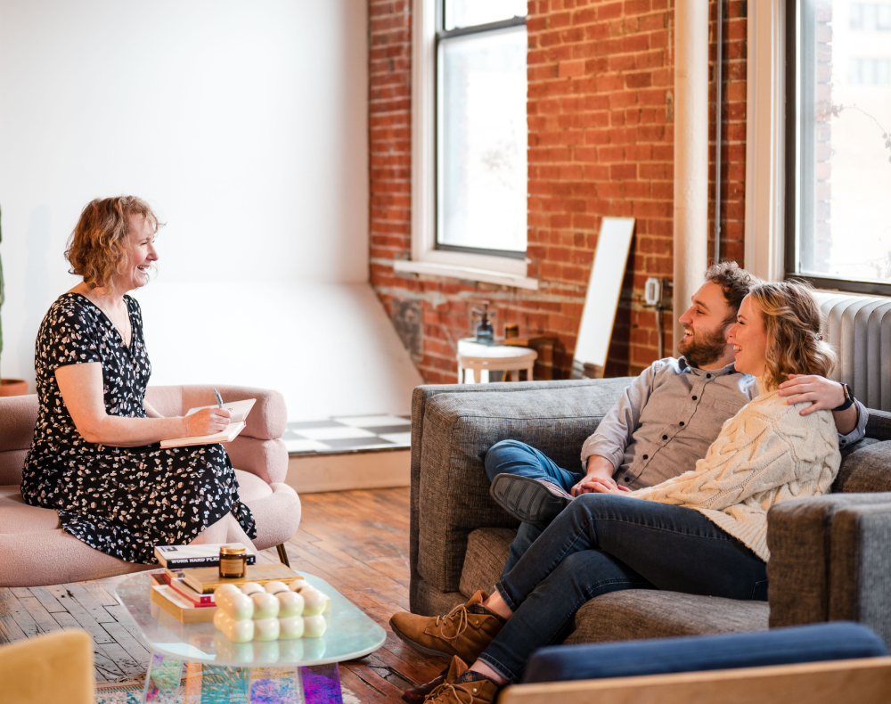 fca014b2838acc3892d0fb9f904fd5a88768ab5b (1) Color image in a circular frame of an infant's hand being held by an adult's hands