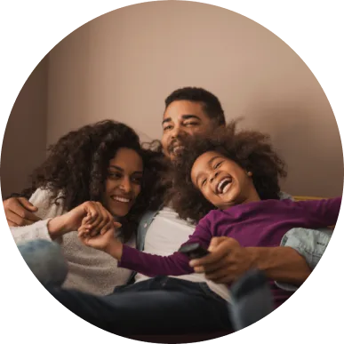 Adoptive family of three smiling together